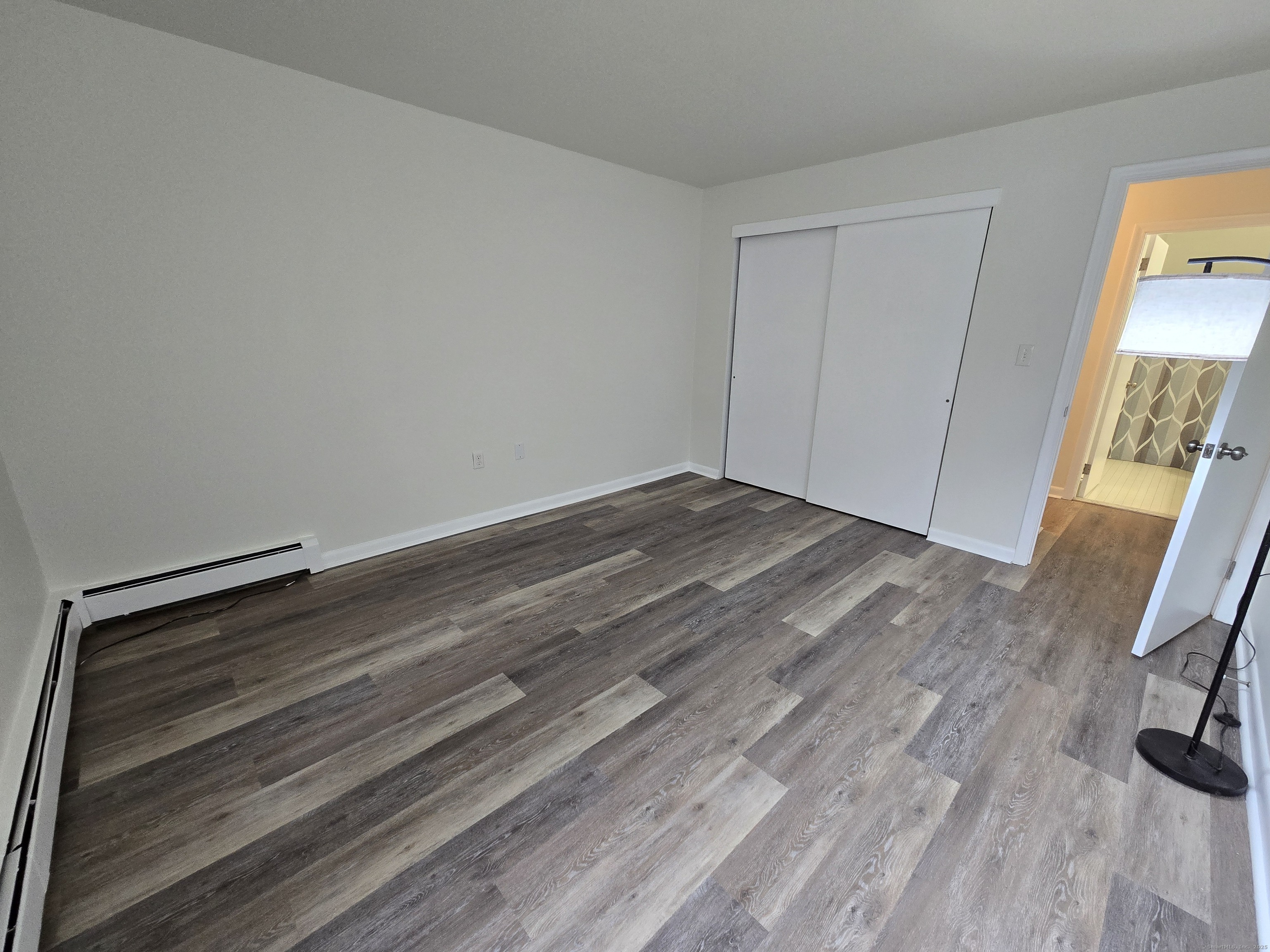 1209 Cromwell Hills Drive, Unit 1209 Cromwell, CT 06416 - Photo 22 of 27 a view of a room with wooden floor
