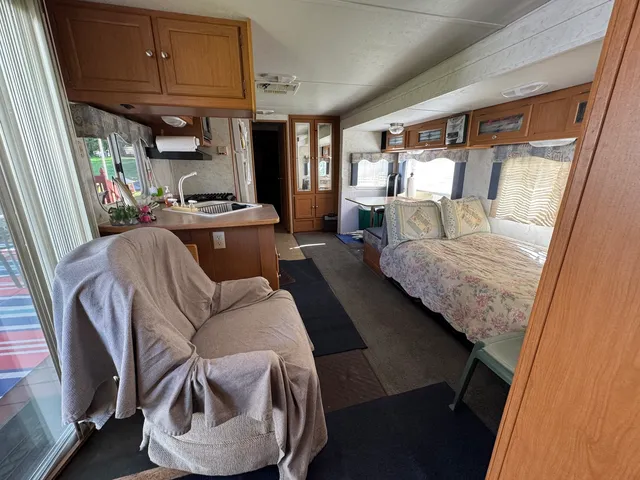 a bedroom with a bed and a mirror