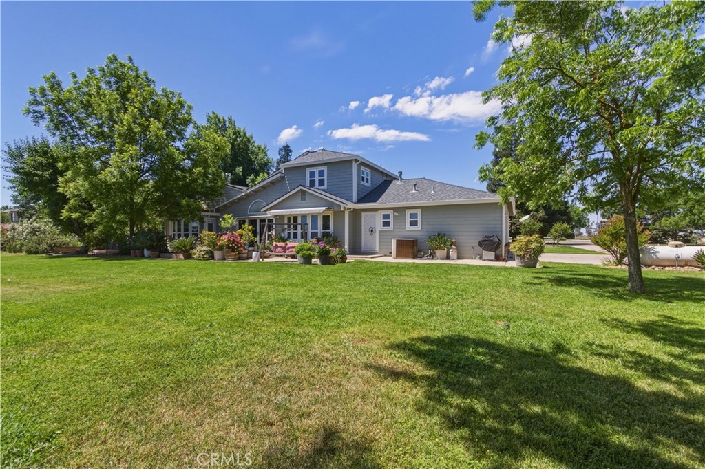 3856 North Gardner Avenue Merced, CA 95340 - Photo 42 of 59 a front view of house with yard and green space