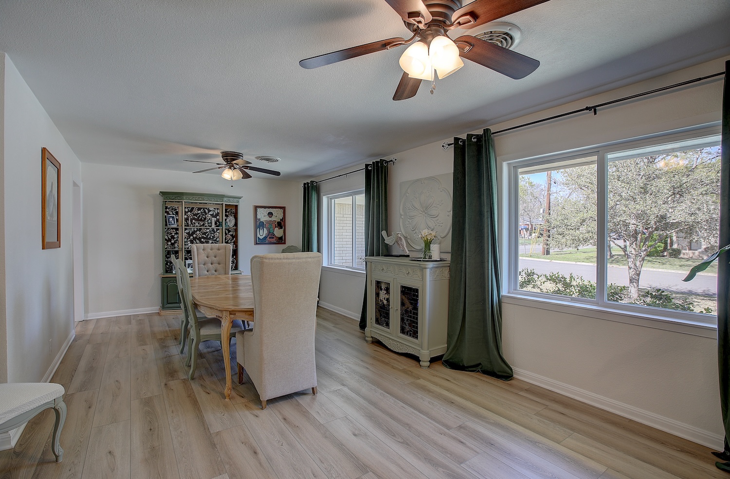 1902 East 18th Street Georgetown, TX 78626 - Photo 14 of 40 Formal living room dining space has 2 ceiling fans, and can be used for flex