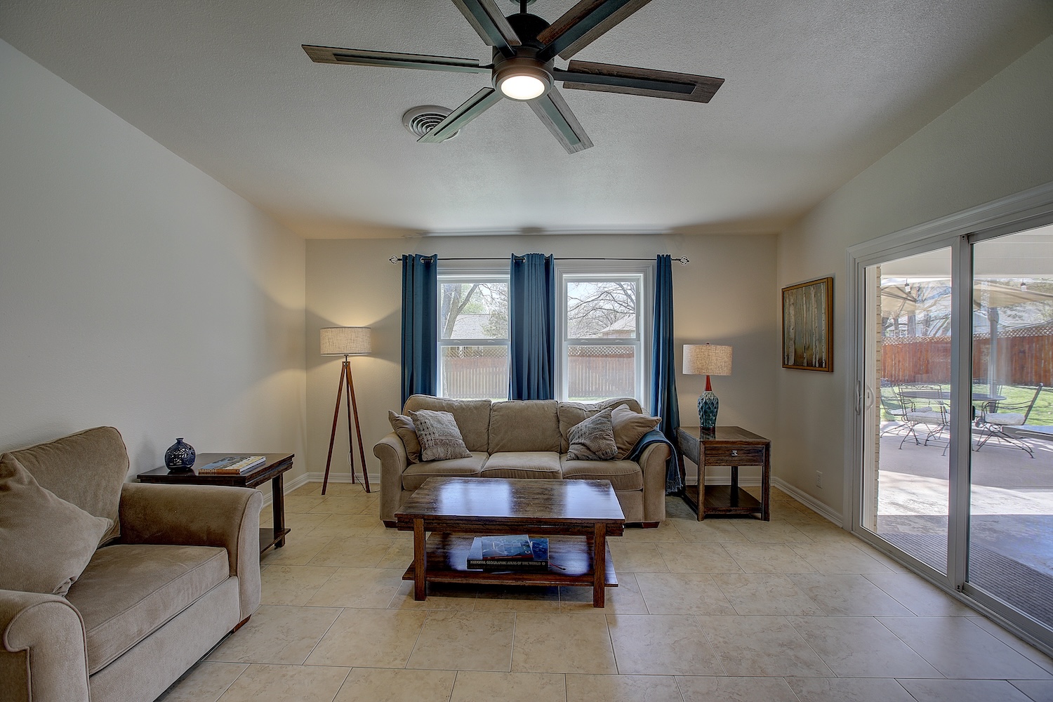 1902 East 18th Street Georgetown, TX 78626 - Photo 16 of 40 Living room featuring a ceiling fan and light tile patterned flooring