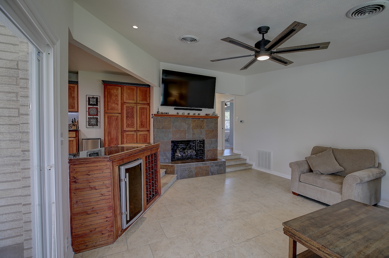 1902 East 18th Street Georgetown, TX 78626 - Photo 21 of 40 Family area featuring a tiled fireplace and a ceiling fan