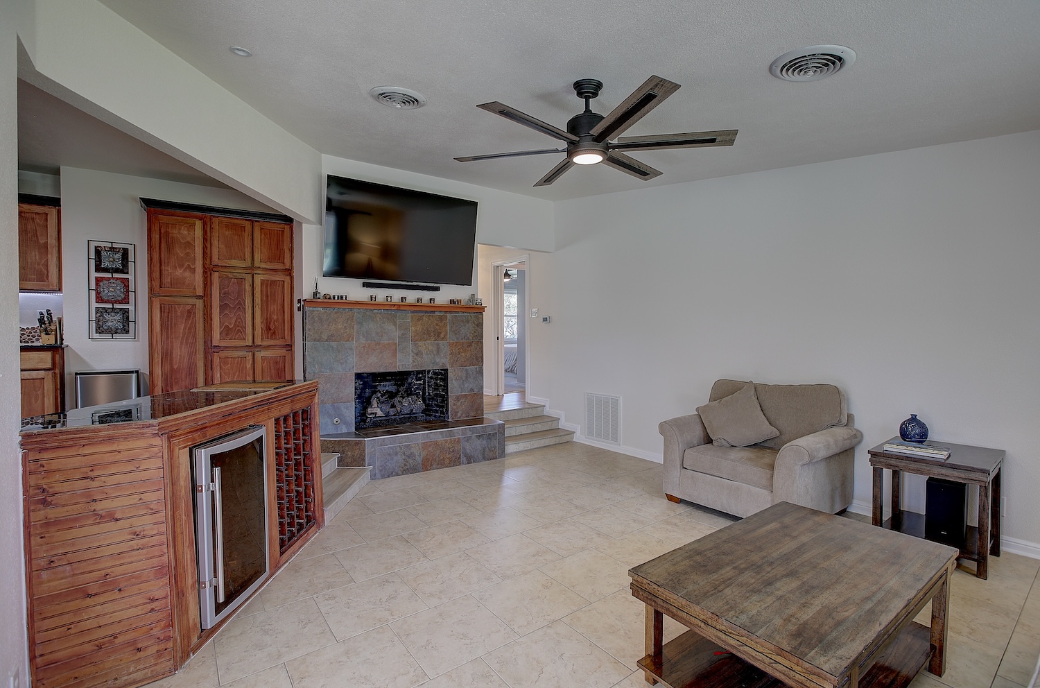 1902 East 18th Street Georgetown, TX 78626 - Photo 22 of 40 Family room featuring a fireplace and a ceiling fan