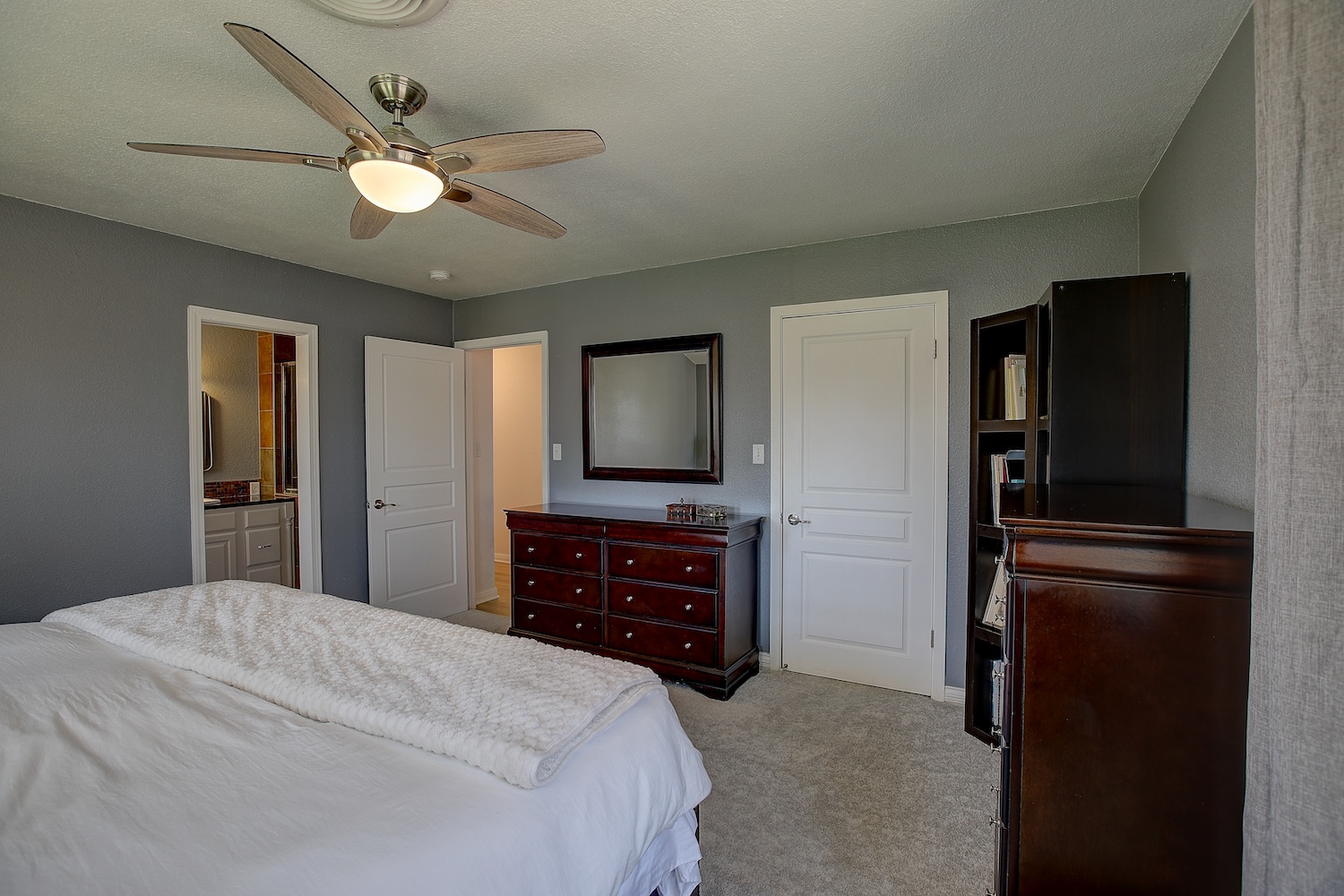 1902 East 18th Street Georgetown, TX 78626 - Photo 24 of 40 Located at the back of the property the primary bedroom is spacious and features an en suite bath and walk in closet