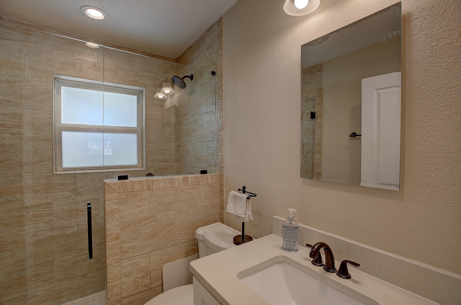 1902 East 18th Street Georgetown, TX 78626 - Photo 32 of 40 Full bath #3 featuring recently installed tile/pony wall, glass enclosure and vanity.