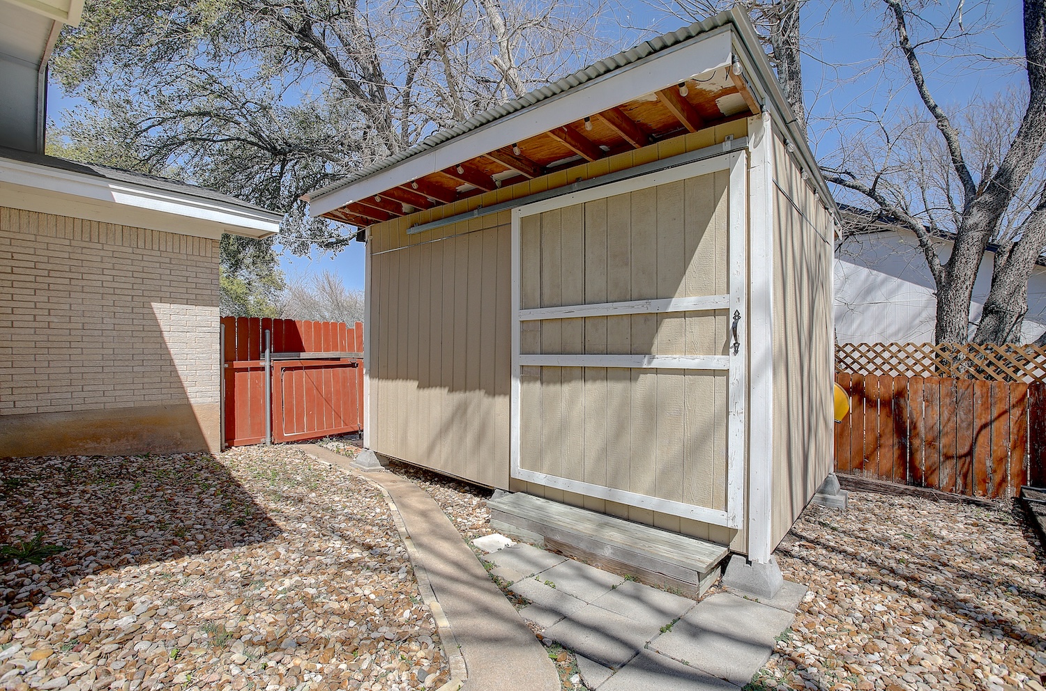 1902 East 18th Street Georgetown, TX 78626 - Photo 4 of 40 Charming 217 sq ft shed with sliding door has reclaimed wood flooring from the local high school gym basketball floors.