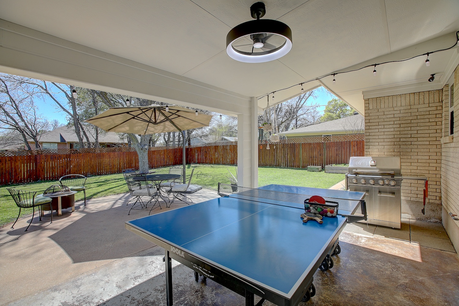 1902 East 18th Street Georgetown, TX 78626 - Photo 5 of 40 Covered patio, with high speed fan, wood privacy fence, and large patio area, and room for pool, sport court, maybe both.