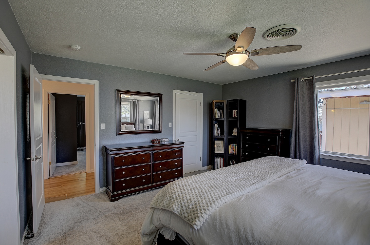 1902 East 18th Street Georgetown, TX 78626 - Photo 6 of 40 Primary bedroom has cozy soft carpet, and an ensuite bath. Walk in Closet.