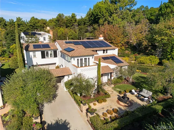 an aerial view of a house with a garden