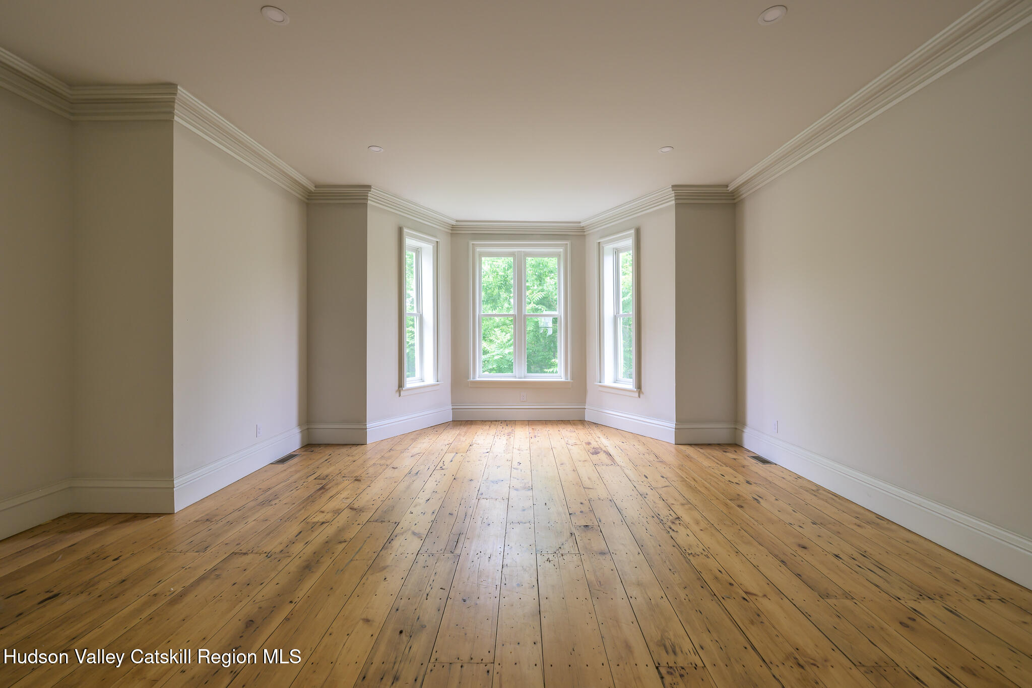 59 Allen Street Hudson, NY 12534 - Photo 13 of 59 a view of an empty room with wooden floor and a window