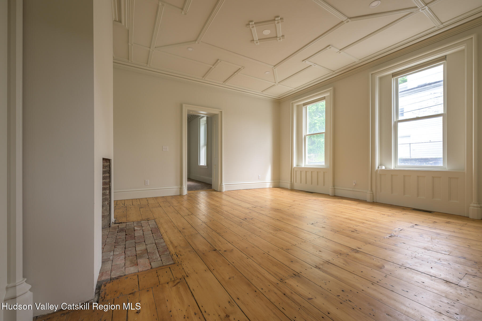 59 Allen Street Hudson, NY 12534 - Photo 17 of 59 an empty room with wooden floor and windows