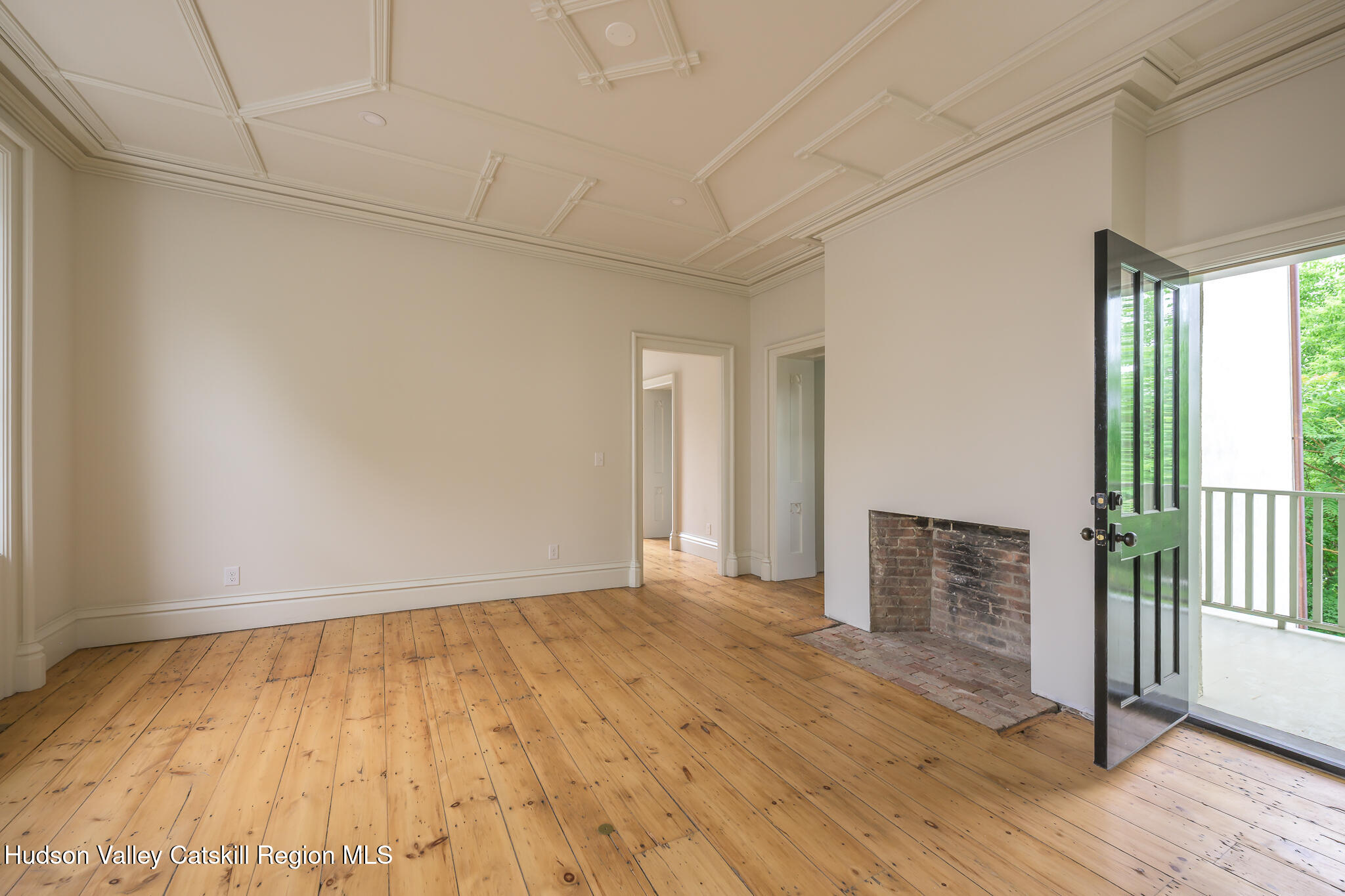 59 Allen Street Hudson, NY 12534 - Photo 19 of 59 a view of an empty room with wooden floor and a window