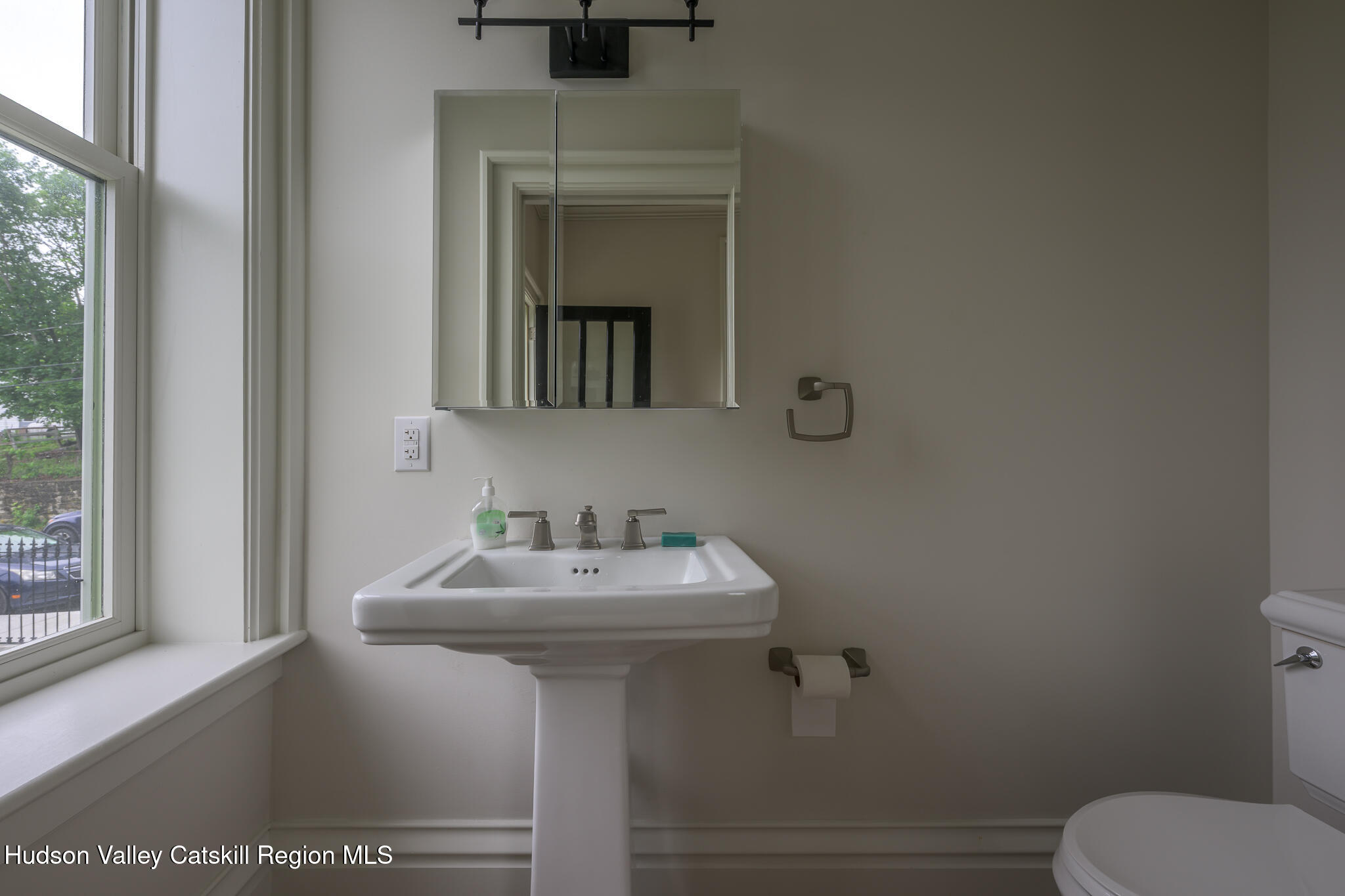 59 Allen Street Hudson, NY 12534 - Photo 26 of 59 a bathroom with a sink mirror and toilet