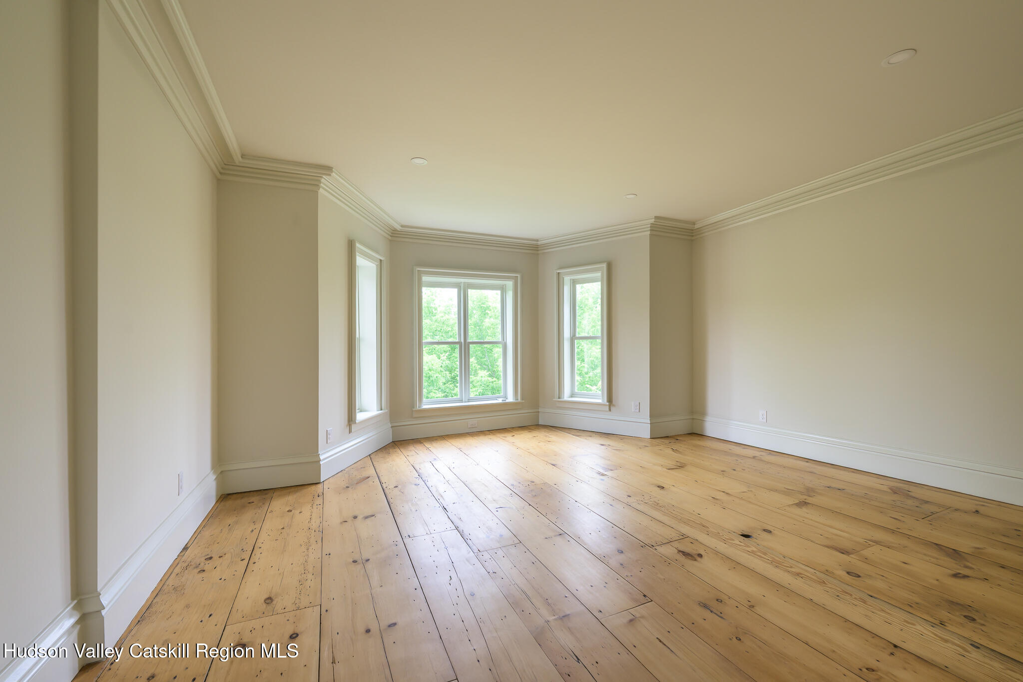 59 Allen Street Hudson, NY 12534 - Photo 31 of 59 a view of an empty room with wooden floor and a window