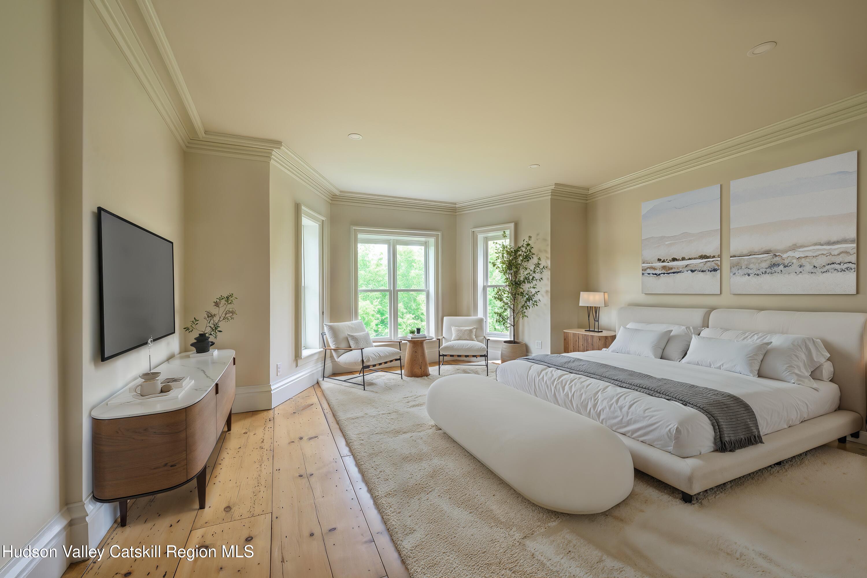 59 Allen Street Hudson, NY 12534 - Photo 32 of 59 a bedroom with a bed and large windows