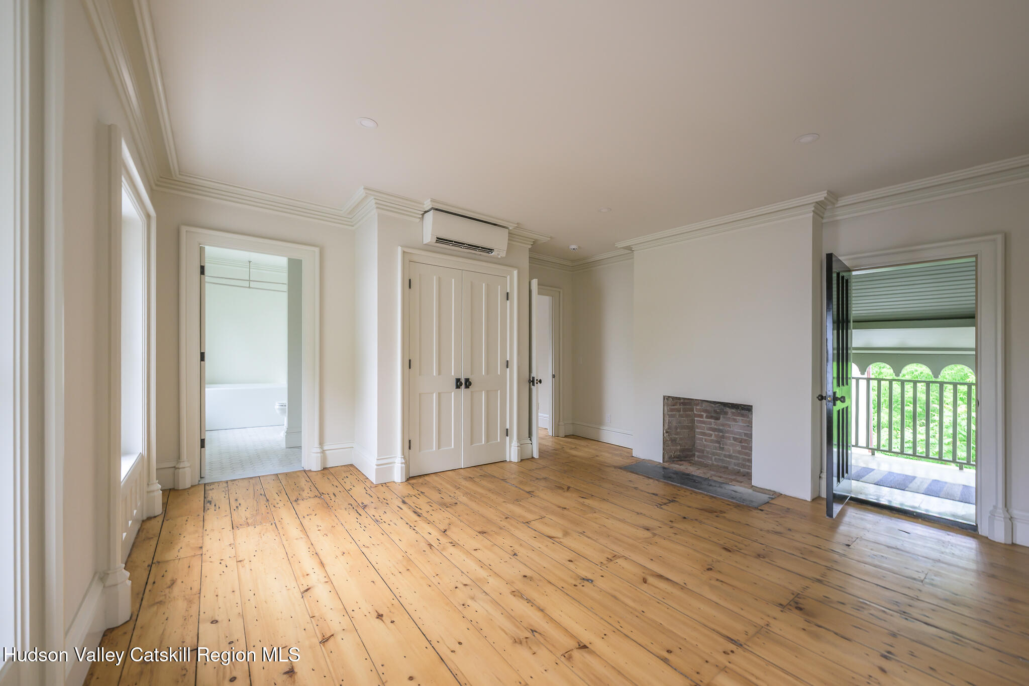 59 Allen Street Hudson, NY 12534 - Photo 40 of 59 a bedroom with a bed and wooden floor