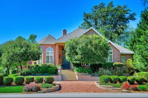 5662 South County Line Road Hinsdale, IL 60521 - Photo 1 of 16 a front view of a house with a yard