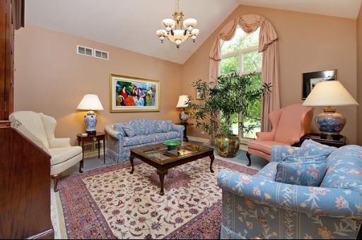 5662 South County Line Road Hinsdale, IL 60521 - Photo 3 of 16 a living room with furniture a table and a window