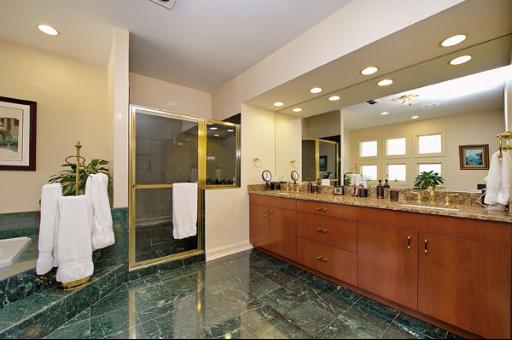 5662 South County Line Road Hinsdale, IL 60521 - Photo 9 of 16 a bathroom with a sink and a mirror
