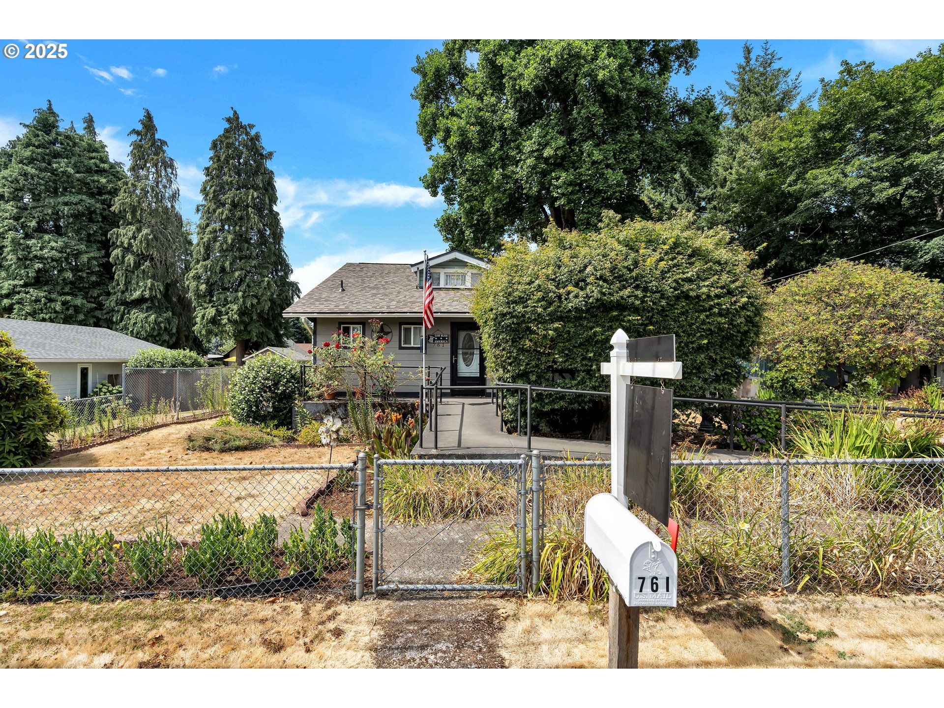 761 Southeast Polk Street Camas, WA 98607 - Photo 1 of 40 a view of a patio with table and chairs with wooden fence