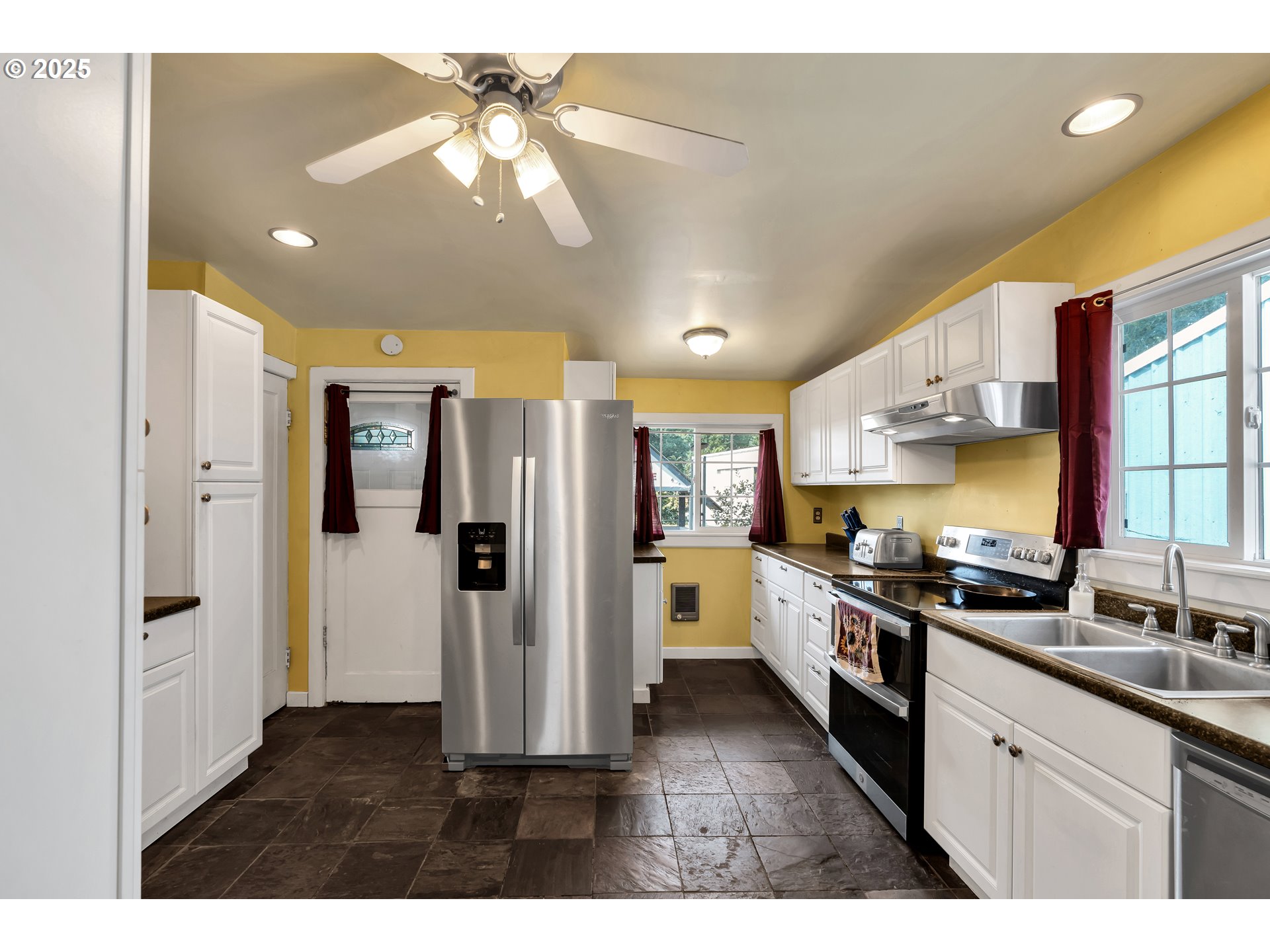 761 Southeast Polk Street Camas, WA 98607 - Photo 11 of 40 a kitchen with a refrigerator and a sink