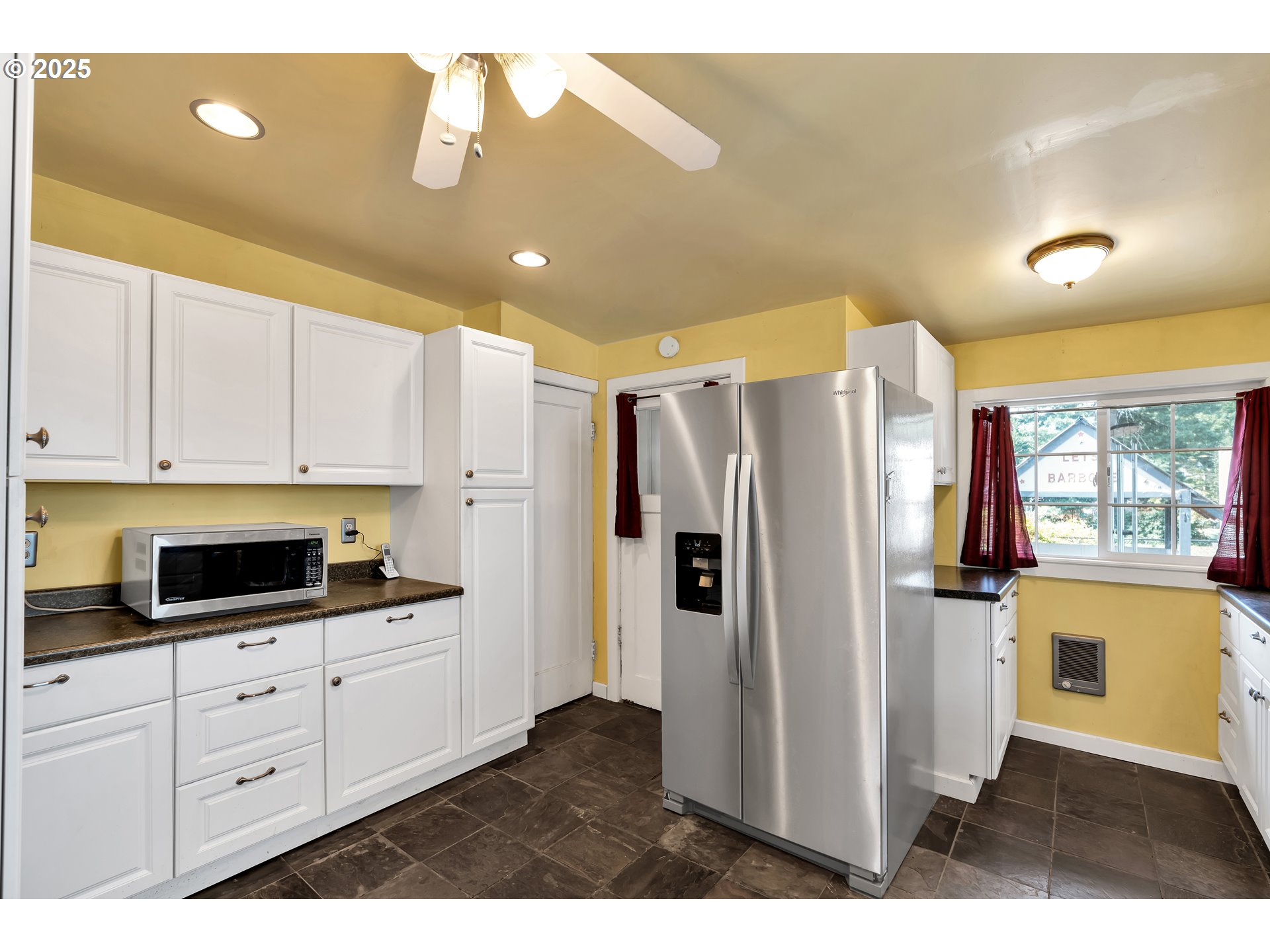 761 Southeast Polk Street Camas, WA 98607 - Photo 12 of 40 a kitchen with stainless steel appliances a refrigerator sink and cabinets