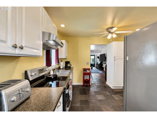 a view of living room with furniture and a chandelier