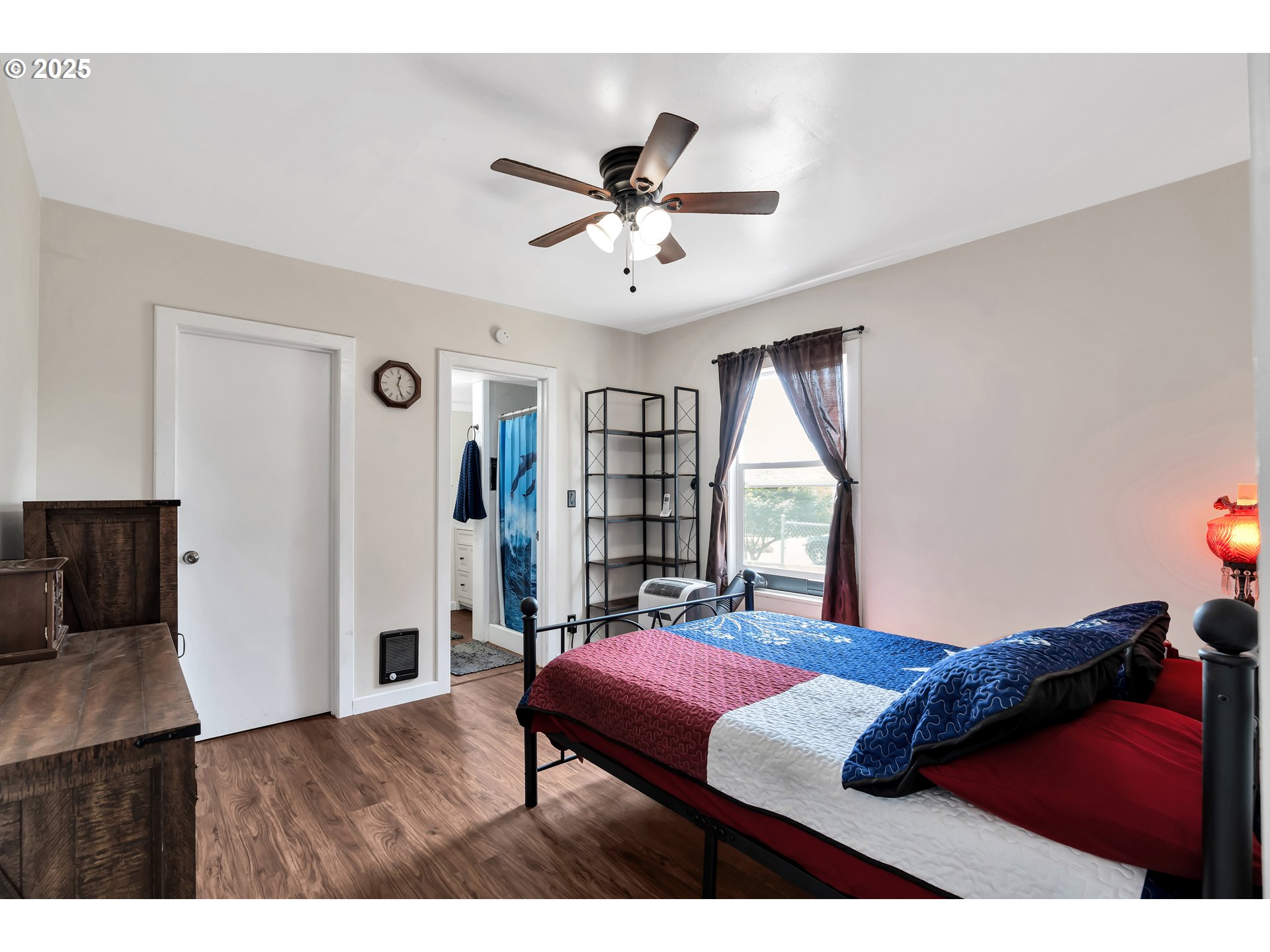 761 Southeast Polk Street Camas, WA 98607 - Photo 19 of 40 a bedroom with a bed and a large window