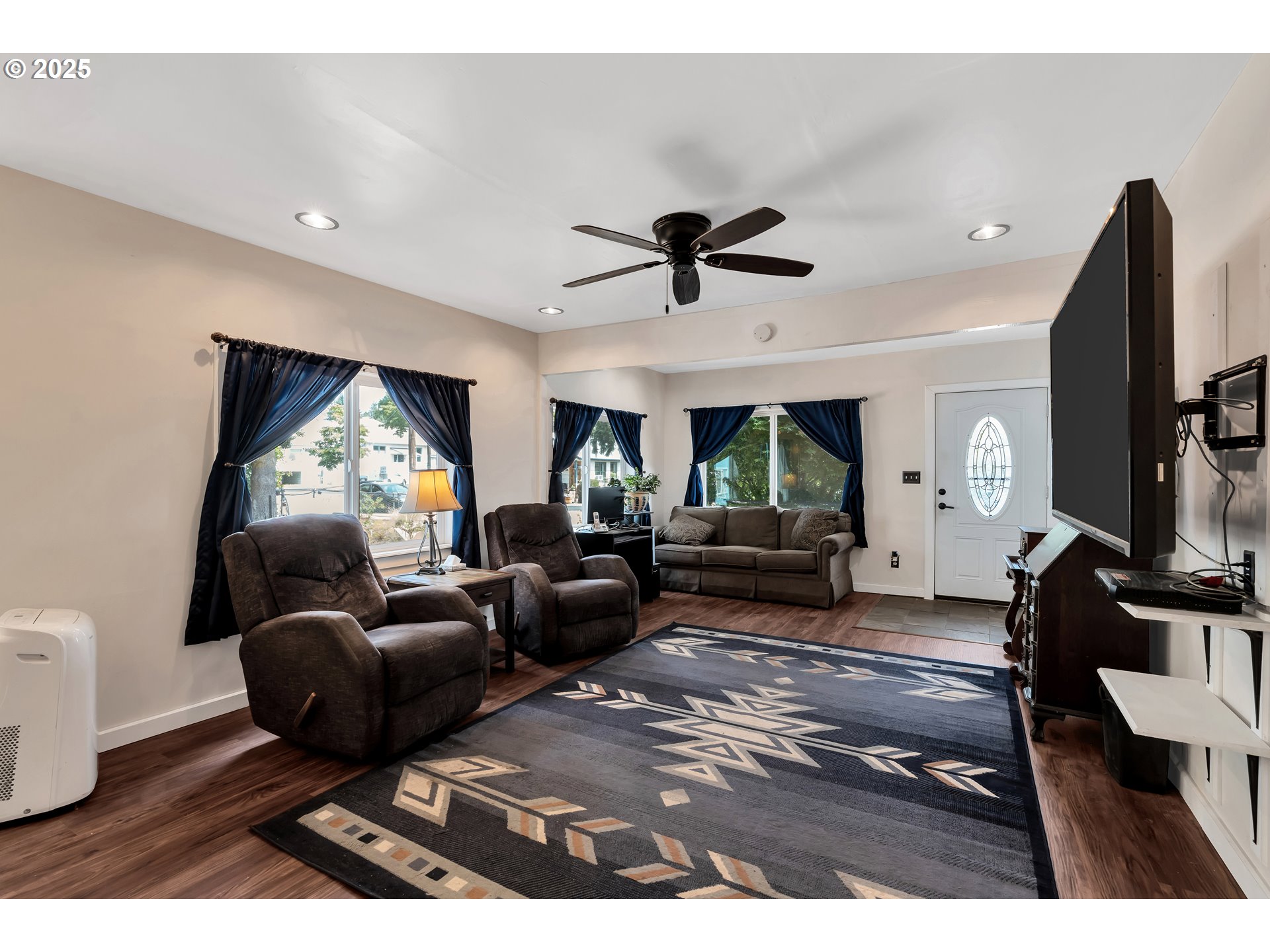 761 Southeast Polk Street Camas, WA 98607 - Photo 7 of 40 a living room with furniture and a flat screen tv