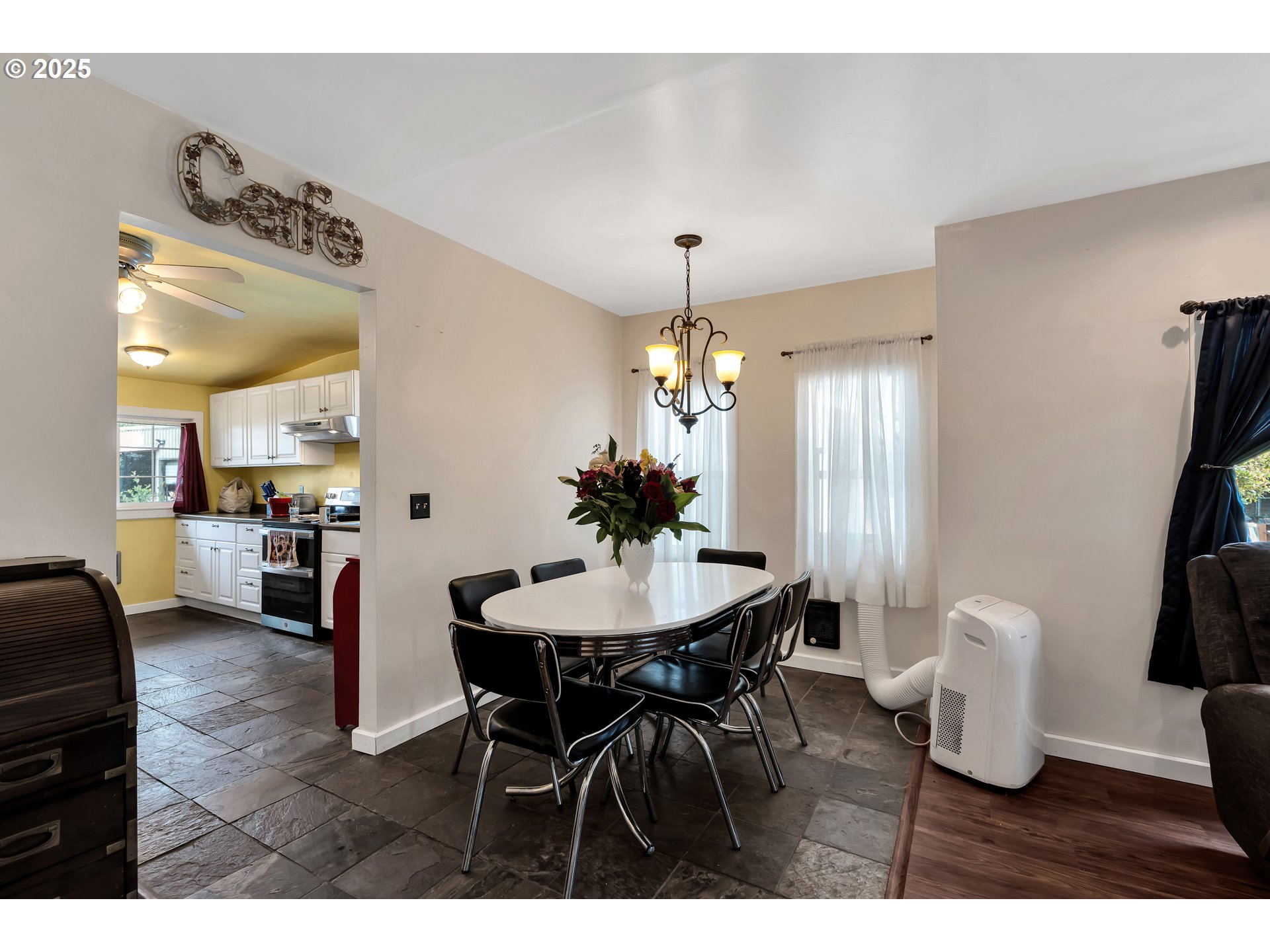 761 Southeast Polk Street Camas, WA 98607 - Photo 9 of 40 a view of a dining room with furniture and wooden floor