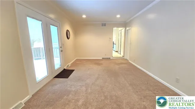 a view of an empty room with a window