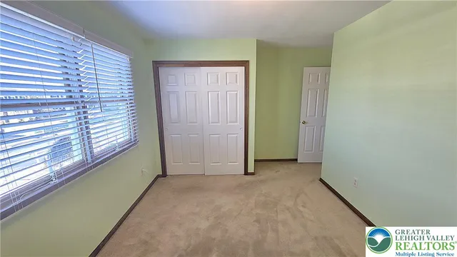 a bathroom with a sink a mirror and shower