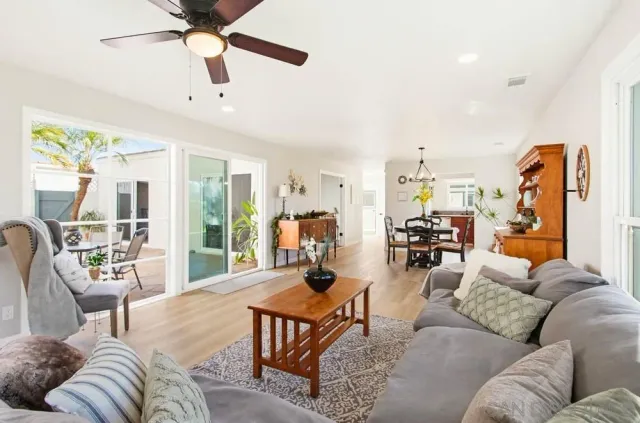 a view of a dining room with furniture and chandelier