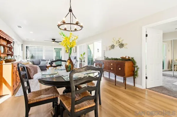 a kitchen with stainless steel appliances granite countertop a refrigerator and wooden cabinets