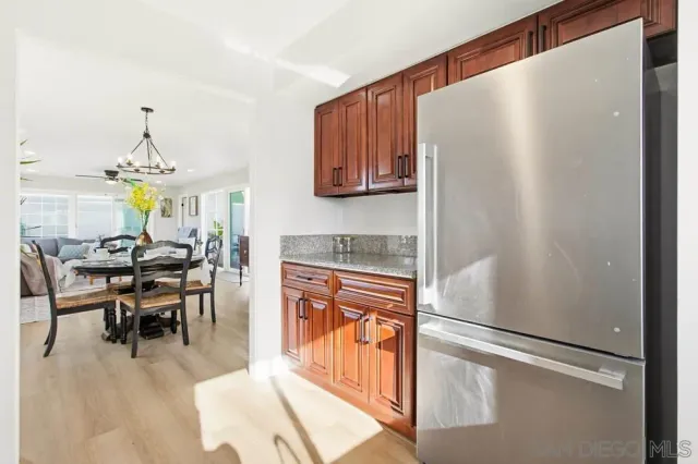 a view of a hallway with furniture and a window