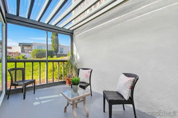 a bedroom with a bed and painting on the wall