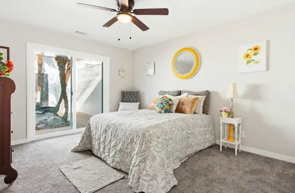 a bedroom with a bed and window