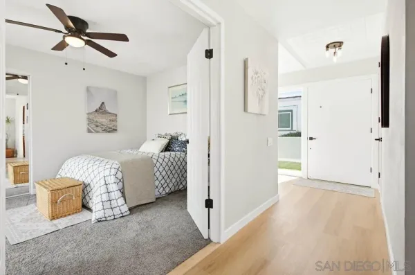 a bedroom with a bed and ceiling fan
