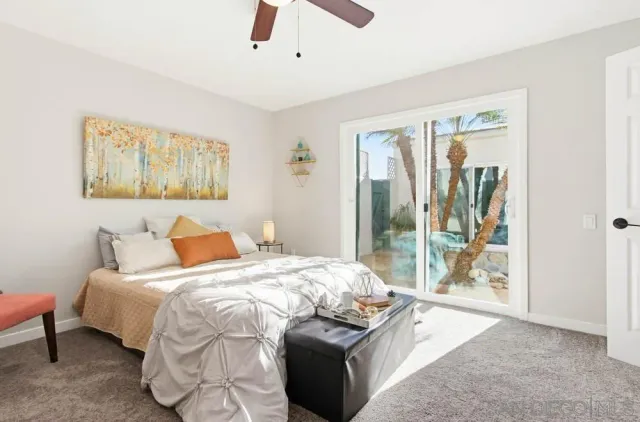 a en suite bathroom with a toilet sink and mirror