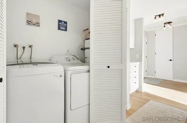 a view of a backyard with a garden and deck