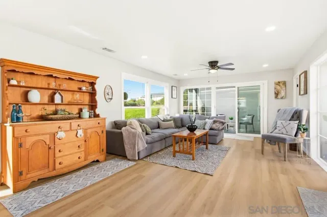 a living room with furniture and a table