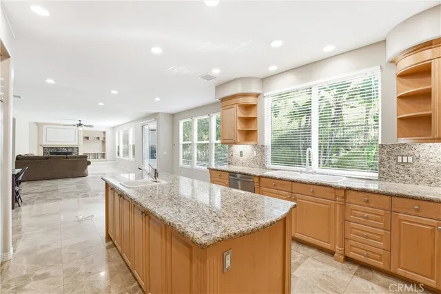 a kitchen with a stove a sink and a microwave