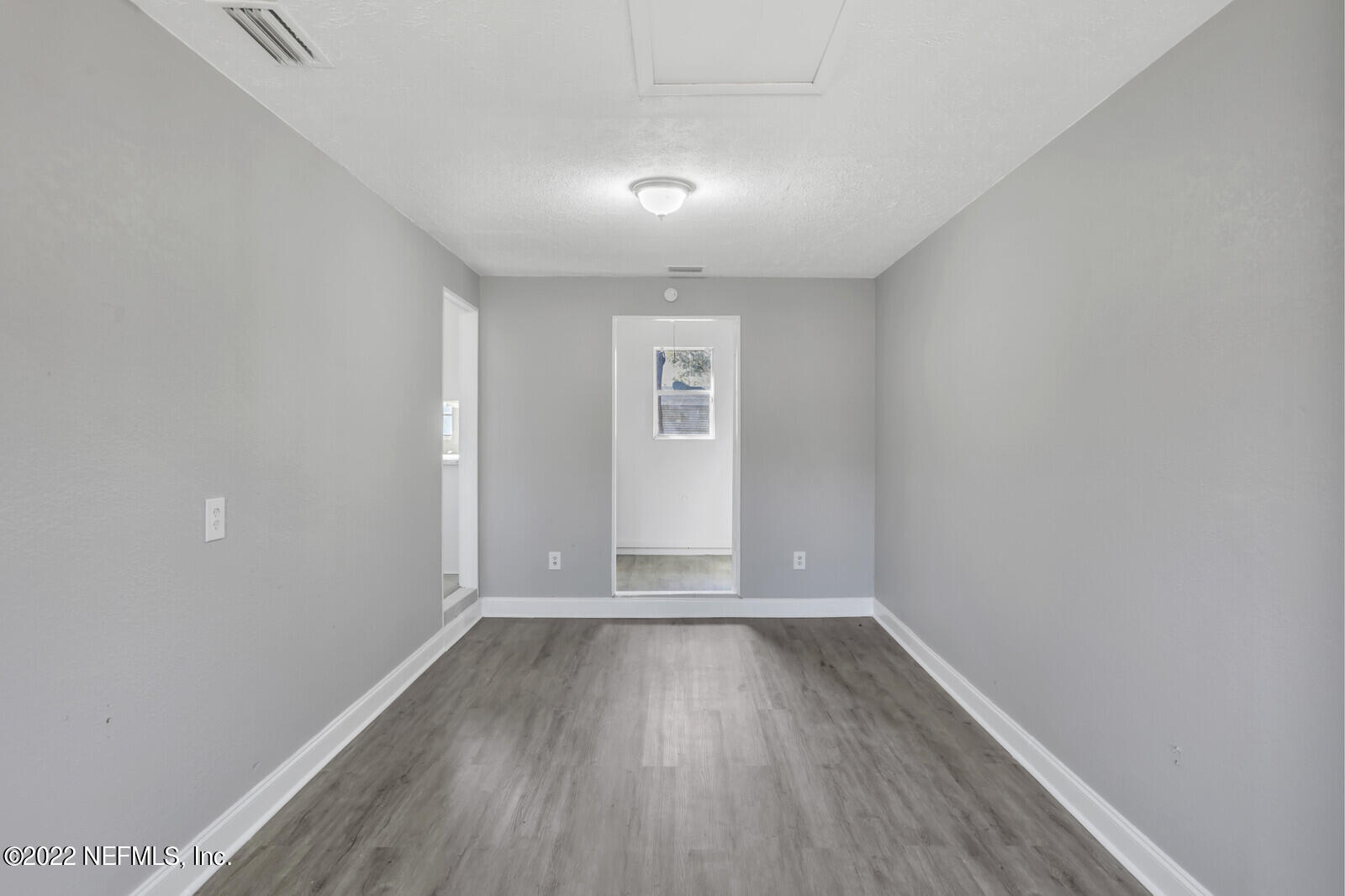 4444 Crossbow Road Jacksonville, FL 32208 - Photo 11 of 15 wooden floor in an empty room