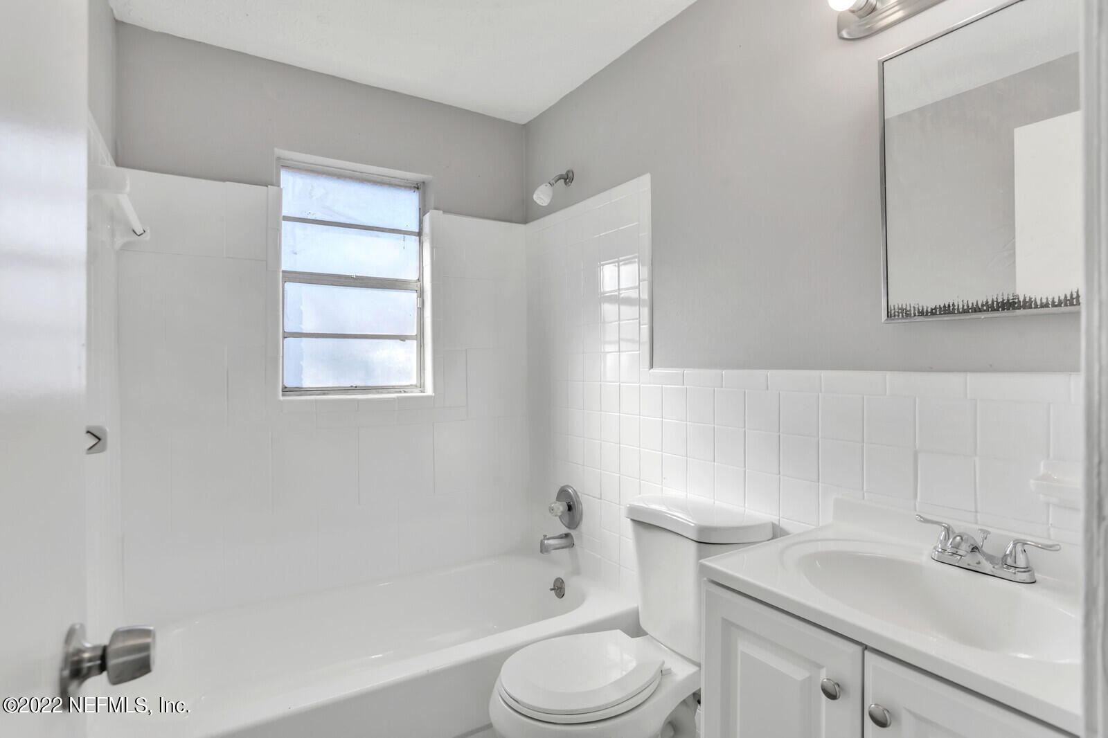 4444 Crossbow Road Jacksonville, FL 32208 - Photo 12 of 15 a bathroom with a sink toilet and bathtub