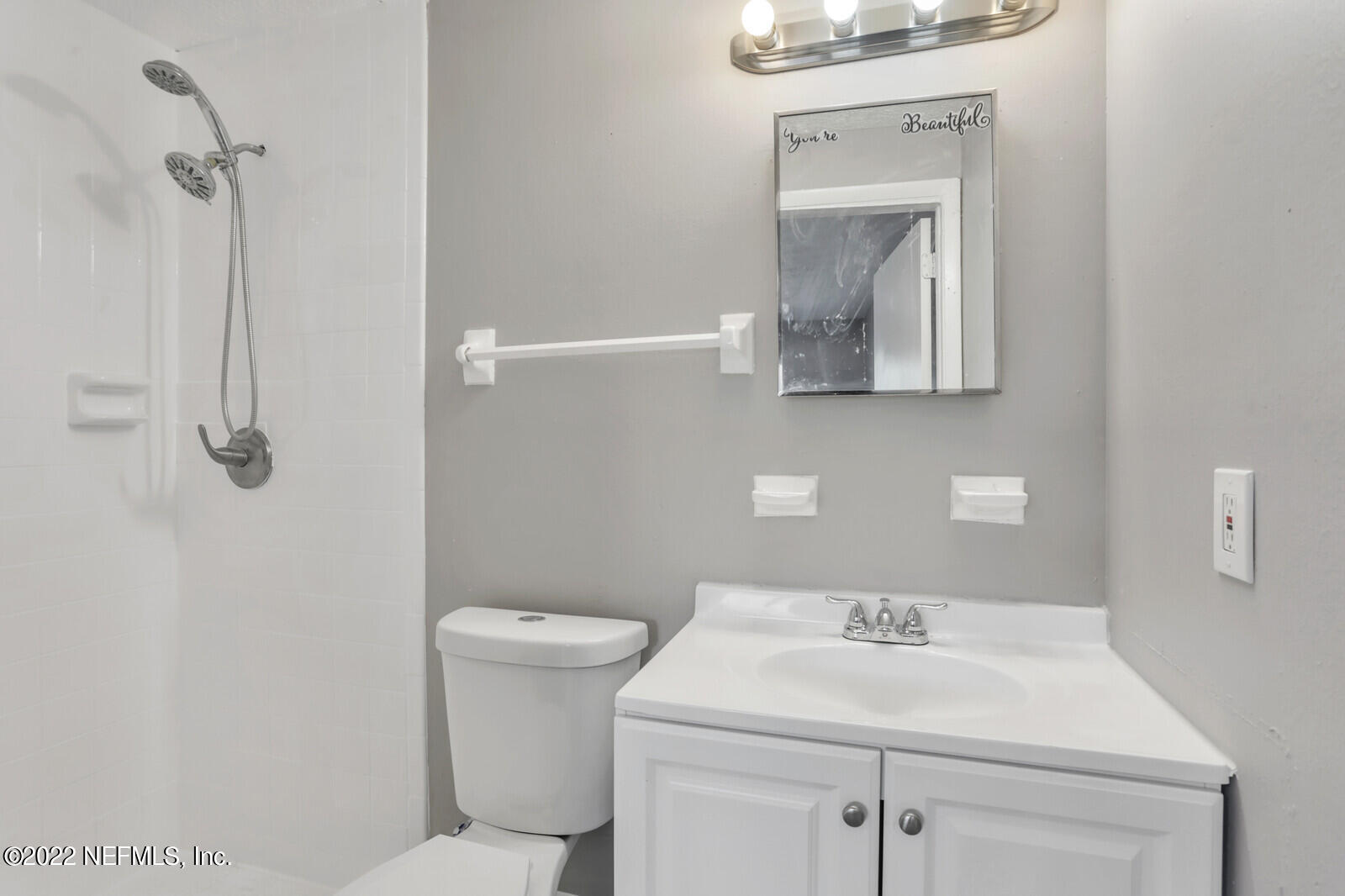 4444 Crossbow Road Jacksonville, FL 32208 - Photo 13 of 15 a bathroom with a sink toilet and vanity