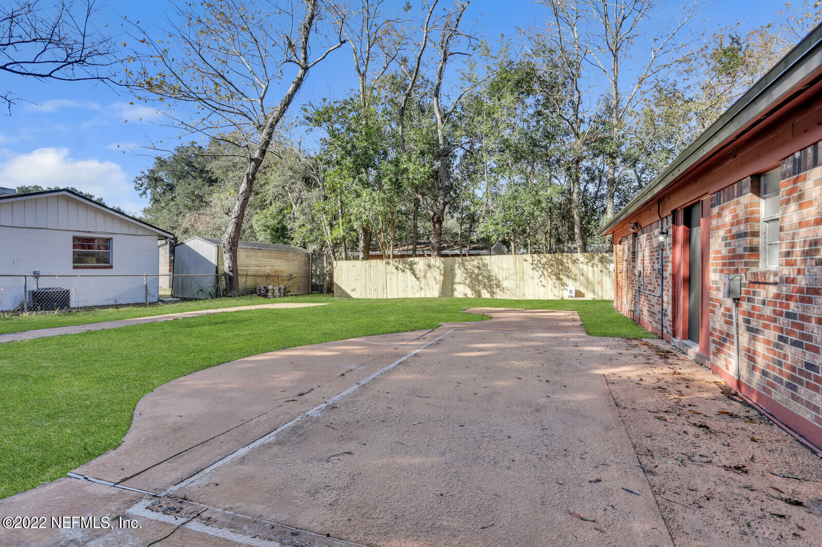 4444 Crossbow Road Jacksonville, FL 32208 - Photo 14 of 15 a view of a house with a yard