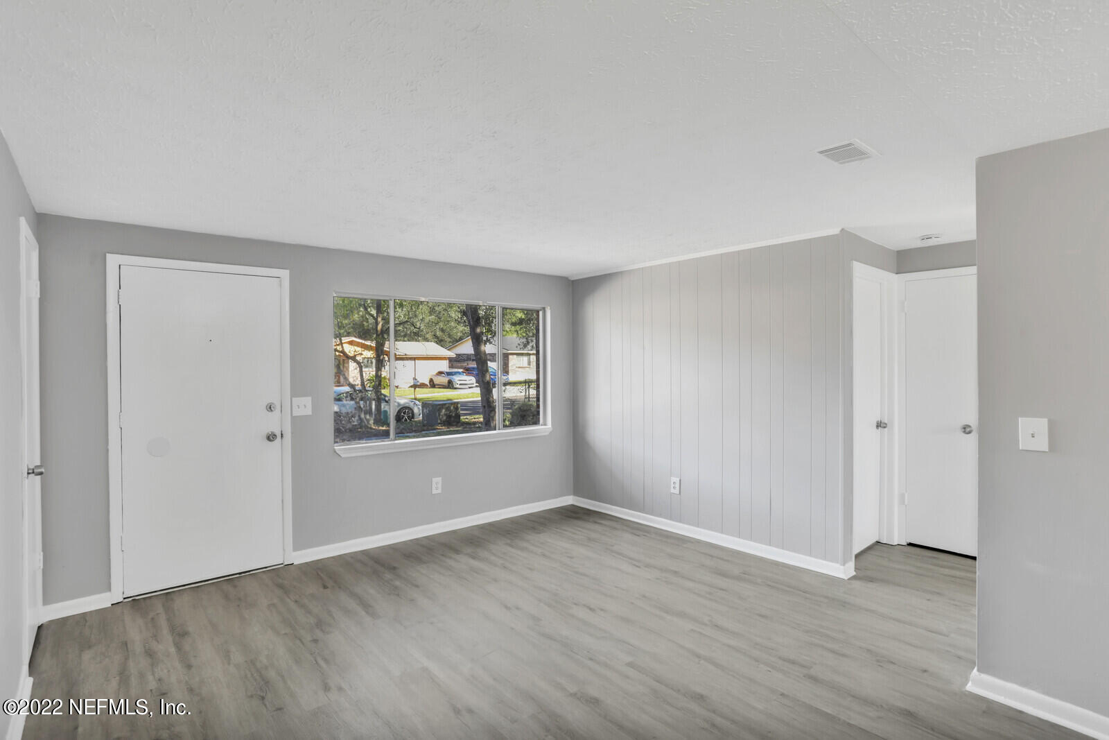 4444 Crossbow Road Jacksonville, FL 32208 - Photo 4 of 15 a view of room with window and hardwood floor