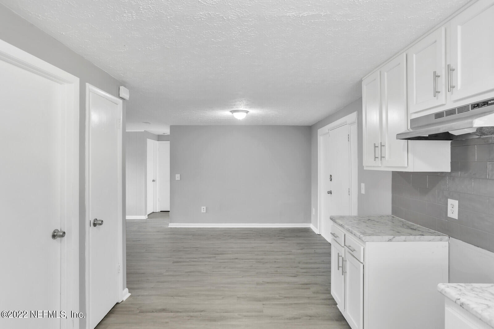 4444 Crossbow Road Jacksonville, FL 32208 - Photo 6 of 15 a view of kitchen with granite countertop cabinets and wooden floor