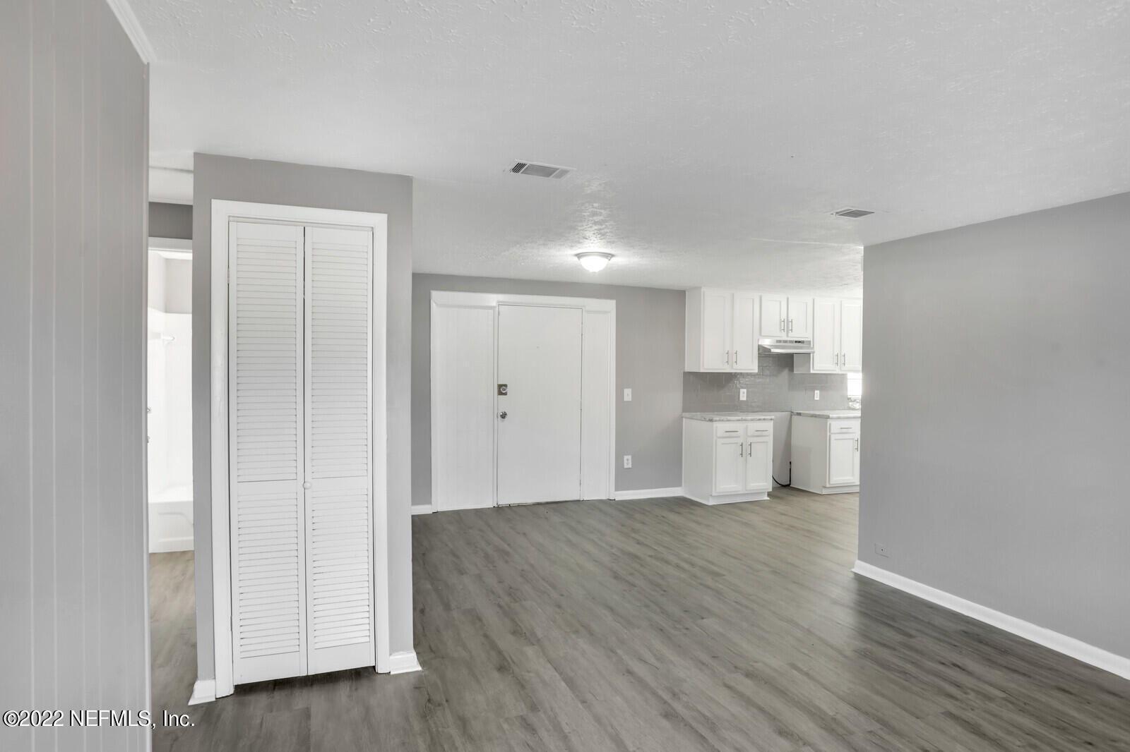 4444 Crossbow Road Jacksonville, FL 32208 - Photo 9 of 15 a view of a kitchen with wooden floor