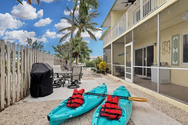a view of a chairs and table in the patio